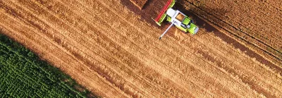 Aerial view of combine on harvest field