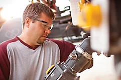 Image of man filling tank with Enlist One®