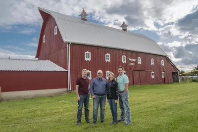 Ted, Jack, Maria and Nick Smith in front of their red barn
