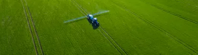 Image of tractor spraying field