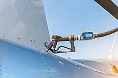 fuel pump in tank with blue sky background