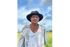 farmer wearing black hat